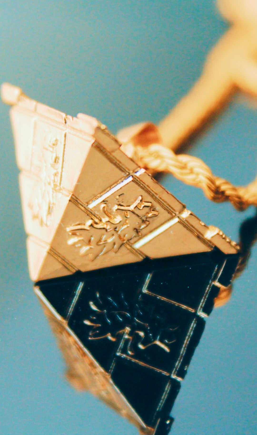 Royalty10 Lion Motif Gold Pyramid Pendant Necklace reflective elegant design.